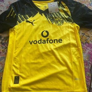Brand new kids Dortmund kit. Puma youth size 24. Fits like a youth medium.